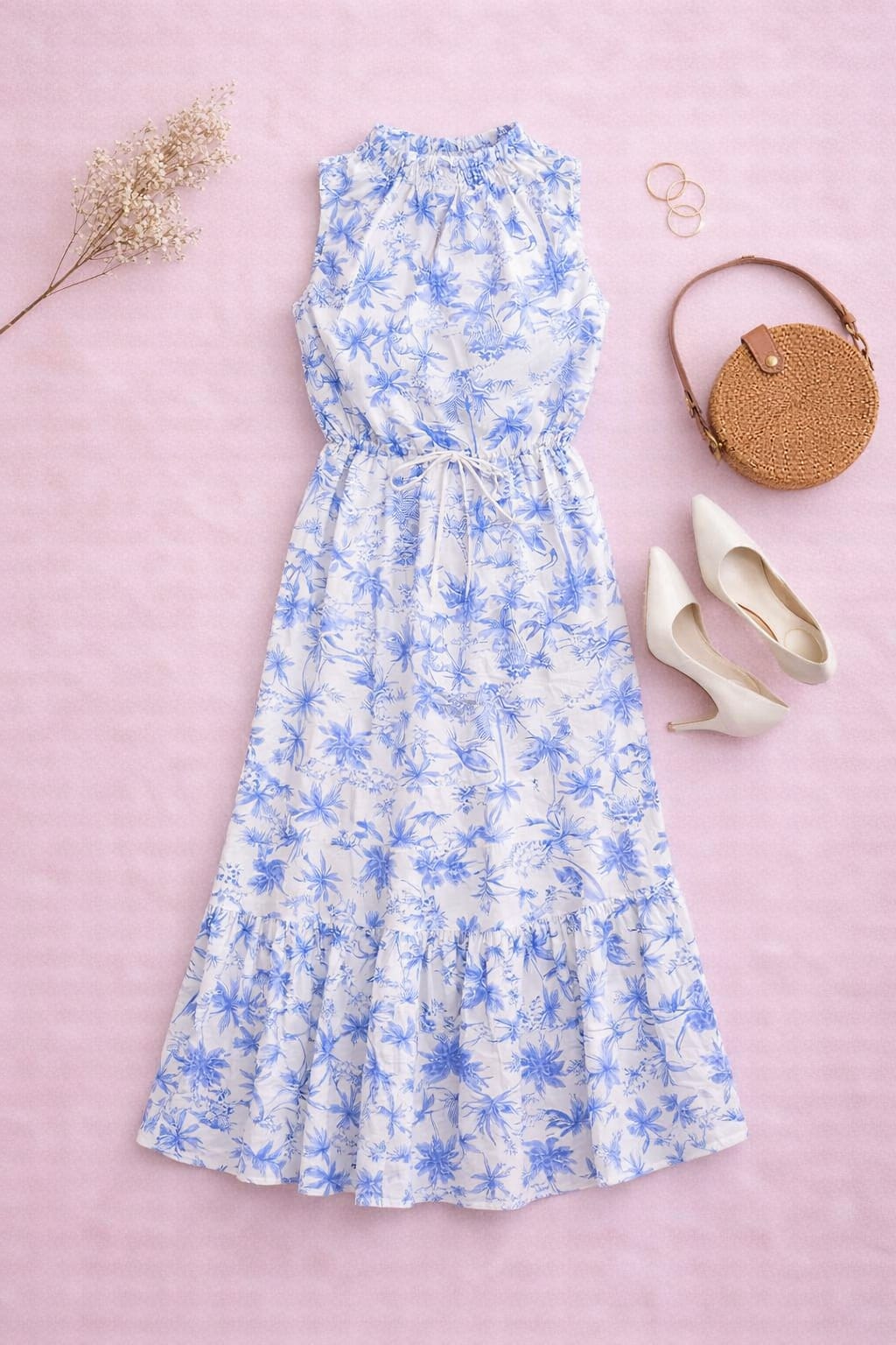 Flat lay of blue white floral fabric on women’s midi dress