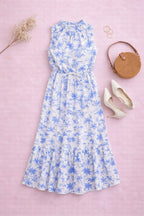 Flat lay of blue white floral fabric on women’s midi dress