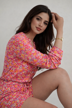 Woman wearing floral summer jumpsuit for casual outings