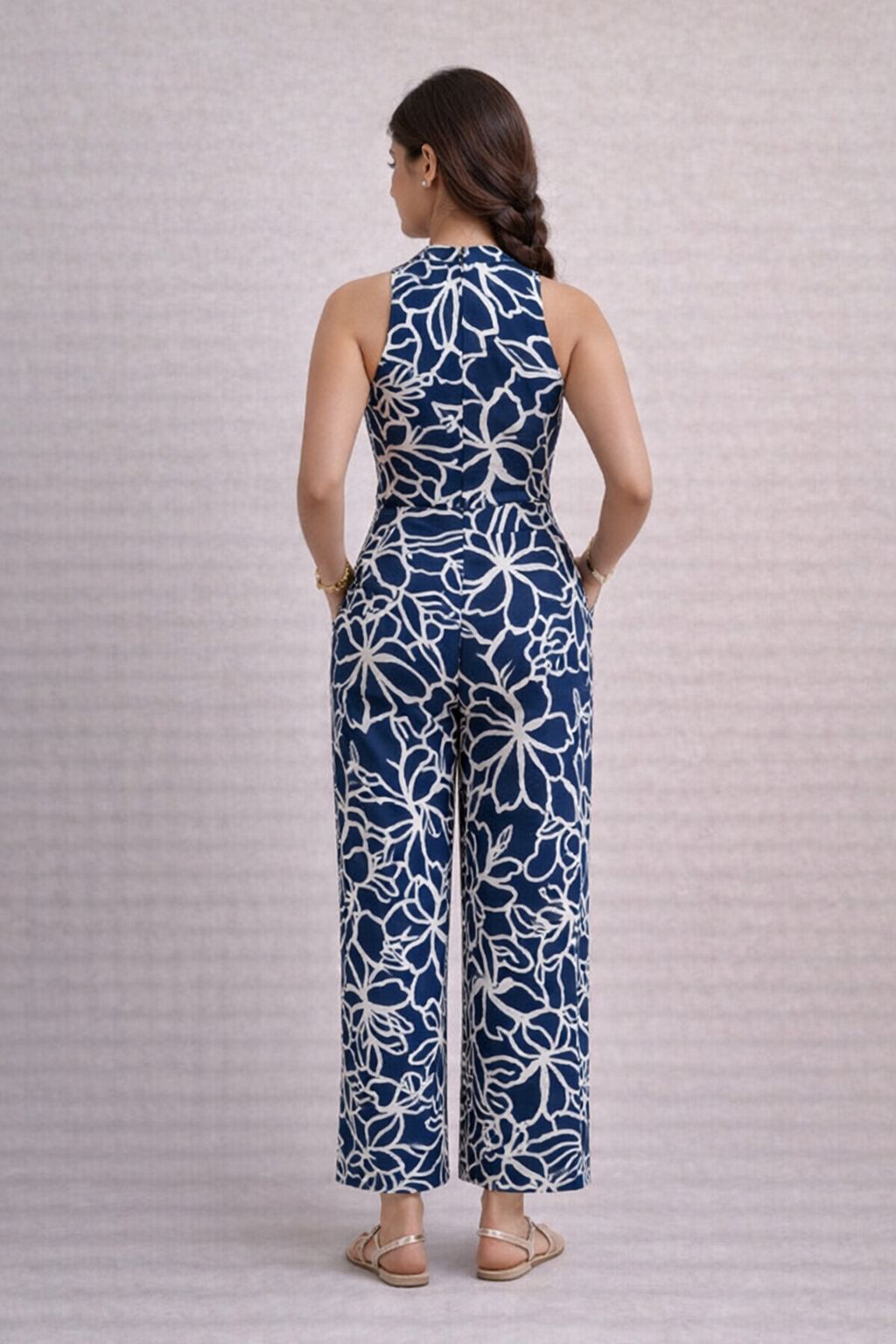 Back view of navy blue floral rayon wide leg jumpsuit for women