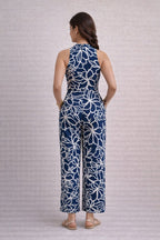 Back view of navy blue floral rayon wide leg jumpsuit for women