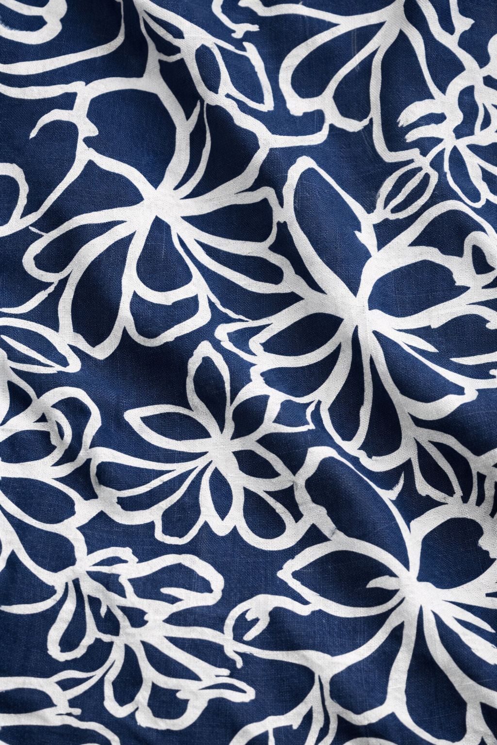 Close-up of navy blue floral rayon fabric on women’s wide leg jumpsuit