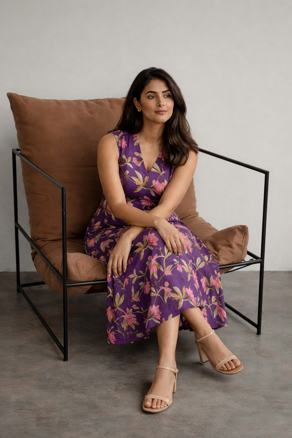 Woman wearing purple floral midi dress for casual summer wear